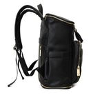 Right side view of a black leather nappy backpack with gold zipper from Tottie