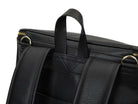 Shot of a hand holding of a black leather nappy backpack with a gold zipper from Tottie