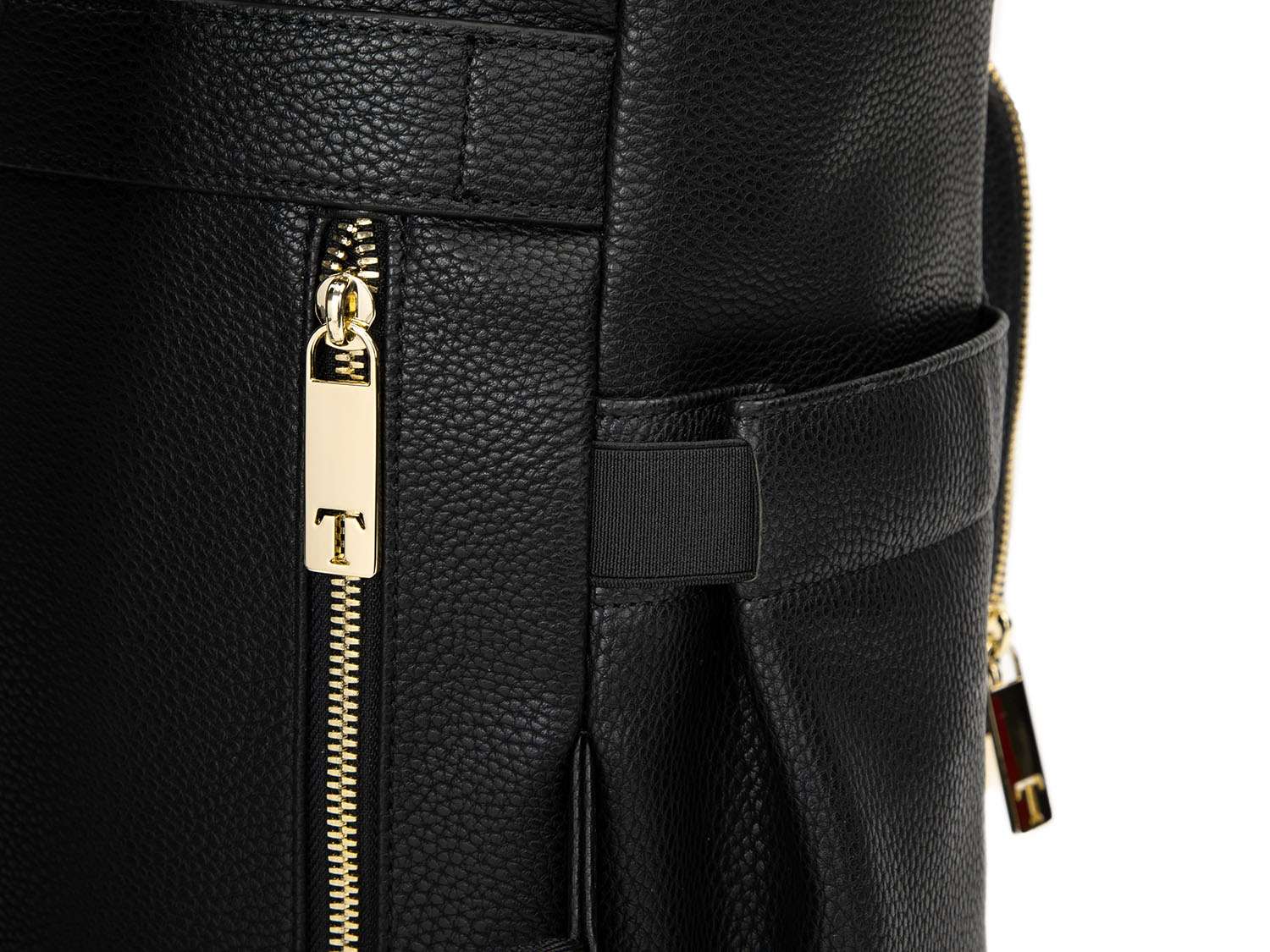 Close-up shot of the gold zipper on a black leather nappy backpack from Tottie