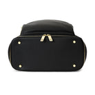 Bottom view of a black leather nappy backpack with a gold zipper from Tottie