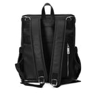 Back view of a black leather nappy backpack with a silver zipper from Tottie