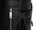 Close-up view of a silver zipper featuring the Tottie logo on a black leather nappy backpack with a silver zipper