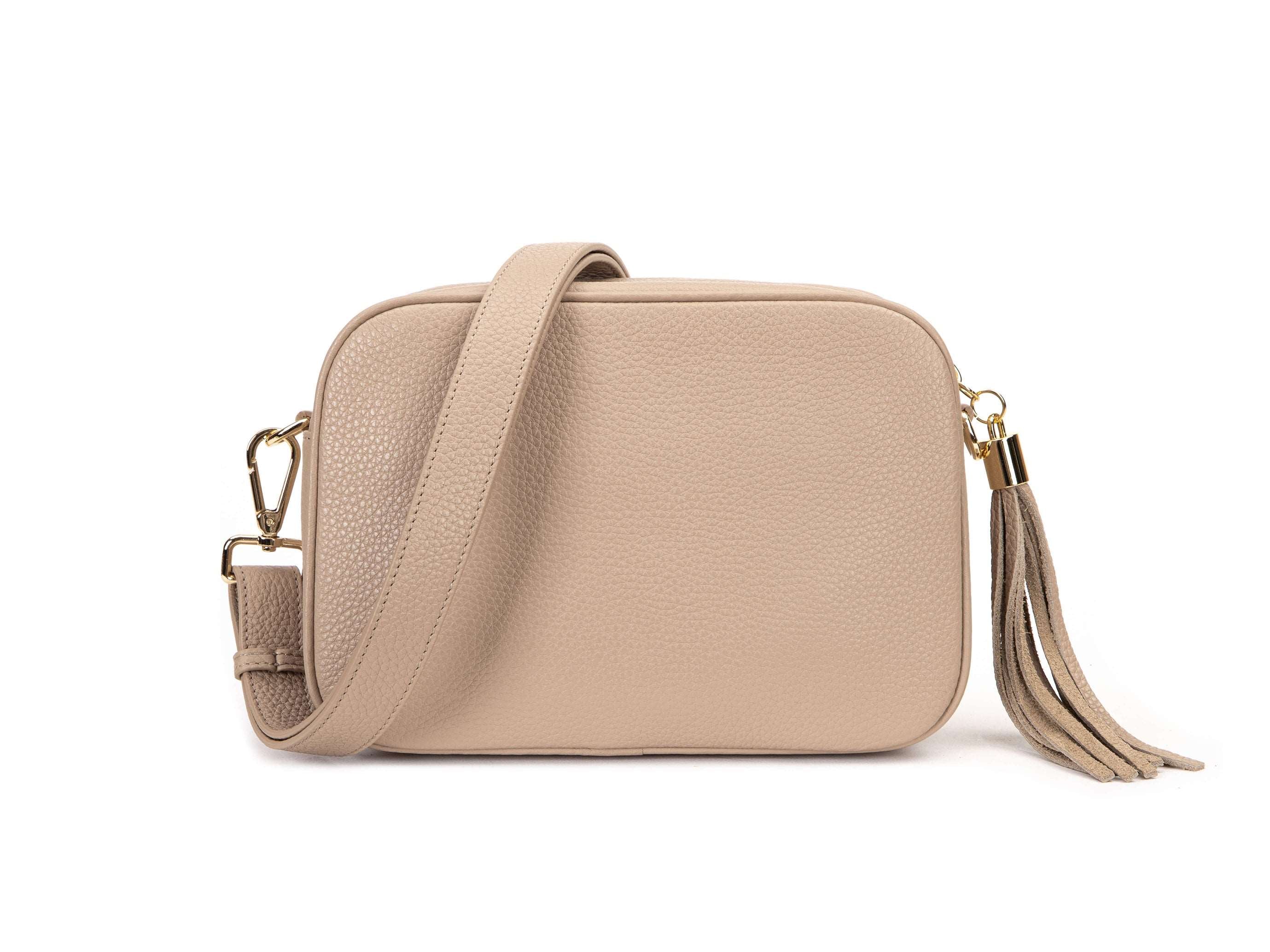 stone colored leather crossbody bag in white background