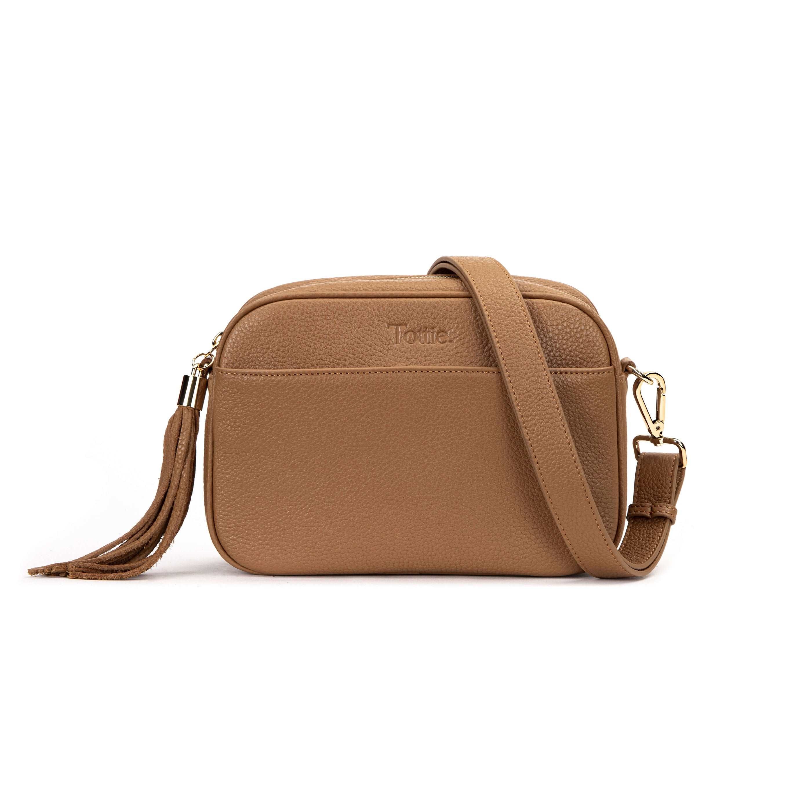 tan colored leather crossbody bag in white background