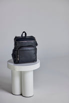 beautiful image of a black leather nappy backpack with a silver zipper from Tottie
